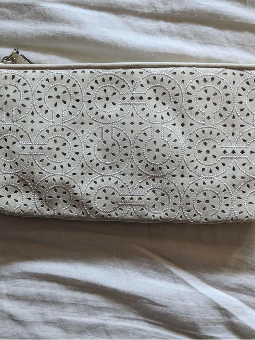 White Coach wristlet handbag with light purple interior